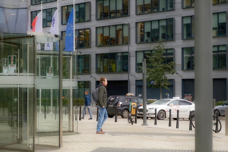 Man in front of a modern building